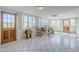 A spacious sunroom with tile flooring and lots of natural light at 1274 E Edgemont Ave, Phoenix, AZ 85006