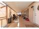 Spacious covered back porch with a door to the house at 1347 S Oak Rd, Maricopa, AZ 85139