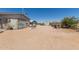 Backyard featuring a detached garage and outbuildings at 1347 S Oak Rd, Maricopa, AZ 85139