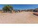 Wide backyard with multiple buildings and a boat at 1347 S Oak Rd, Maricopa, AZ 85139