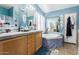 The bathroom features a dual sink vanity, tub, and shower at 1347 S Oak Rd, Maricopa, AZ 85139
