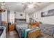 Cozy bedroom with hardwood floors, soft lighting and ample storage at 1347 S Oak Rd, Maricopa, AZ 85139