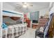Bedroom featuring a bunk bed, ceiling fan and a dresser at 1347 S Oak Rd, Maricopa, AZ 85139