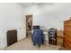Bedroom featuring a desk, chair, and a dresser at 1347 S Oak Rd, Maricopa, AZ 85139