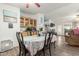 Open dining area with access to the kitchen and living area, filled with natural light at 1347 S Oak Rd, Maricopa, AZ 85139