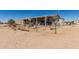 Exterior shot of the home with a porch and desert landscaping at 1347 S Oak Rd, Maricopa, AZ 85139