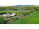 Aerial view of home on golf course with desert landscaping and mountain views at 1637 N Quartz Valley Rd, Scottsdale, AZ 85266