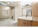Modern bathroom features a tiled shower, sleek vanity with a quartz countertop, and black hardware at 1637 N Quartz Valley Rd, Scottsdale, AZ 85266