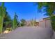 Home's front exterior features a private driveway, desert landscaping, and a two-car garage at 1637 N Quartz Valley Rd, Scottsdale, AZ 85266