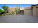 Front exterior view with desert landscaping, a private driveway, and a two-car garage at 1637 N Quartz Valley Rd, Scottsdale, AZ 85266