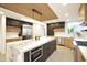 Stylish kitchen featuring marble countertop island, stainless appliances and modern cabinetry at 1637 N Quartz Valley Rd, Scottsdale, AZ 85266