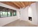 Comfortable living room features a fireplace and a large window at 1637 N Quartz Valley Rd, Scottsdale, AZ 85266
