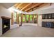 Living room with views of desert landscaping, a fireplace and custom cabinetry at 1637 N Quartz Valley Rd, Scottsdale, AZ 85266