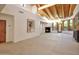 Open-concept living room featuring a fireplace and multiple windows with lush outdoor views at 1637 N Quartz Valley Rd, Scottsdale, AZ 85266