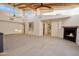 Modern living room featuring high ceilings, a fireplace, and abundant natural light at 1637 N Quartz Valley Rd, Scottsdale, AZ 85266