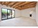Bright living room boasts beamed ceilings, fireplace, and a walkout to the pool at 1637 N Quartz Valley Rd, Scottsdale, AZ 85266