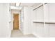 This well-lit walk-in closet features ample shelving and drawers at 1637 N Quartz Valley Rd, Scottsdale, AZ 85266