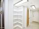Well-organized walk-in closet with shelving and storage spaces at 1637 N Quartz Valley Rd, Scottsdale, AZ 85266