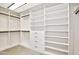 Spacious walk-in closet features custom shelving and ample storage at 1637 N Quartz Valley Rd, Scottsdale, AZ 85266
