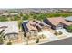 Aerial view of a single-Gathering home showing the roof with solar panels, desert landscaping, and other houses in the community at 17018 W Saguaro Park Ln, Surprise, AZ 85387