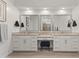 Bright bathroom featuring granite countertops, double sinks and a vanity at 17018 W Saguaro Park Ln, Surprise, AZ 85387