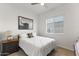 Bedroom featuring neutral decor, wood floors, and natural light from window at 17018 W Saguaro Park Ln, Surprise, AZ 85387