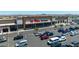 Fry's Marketplace with parking and customers walking in with retail and grocery options in a convenient location at 17018 W Saguaro Park Ln, Surprise, AZ 85387