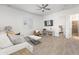 Open-concept living room featuring neutral decor and tile flooring at 17018 W Saguaro Park Ln, Surprise, AZ 85387