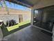 Back patio with a covered BBQ area and a gated entrance leading to a manicured yard at 1718 S Longmore St # 53, Mesa, AZ 85202