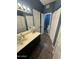 Bathroom with a wooden floor, blue walls, and a vanity with a dark cabinet and neutral countertop at 1718 S Longmore St # 53, Mesa, AZ 85202
