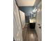 Cozy bathroom features a single sink vanity, a shower with a curtain, and wood-look floors at 1718 S Longmore St # 53, Mesa, AZ 85202