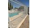 Community pool area enclosed by a secure fence, offering residents a refreshing and safe recreational space at 1718 S Longmore St # 53, Mesa, AZ 85202