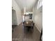 Dining room with wood floors and lighting fixture, open to the kitchen at 1718 S Longmore St # 53, Mesa, AZ 85202
