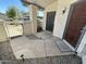 Inviting front porch with stylish stone, secure wrought iron door, and solar lighting at 1718 S Longmore St # 53, Mesa, AZ 85202