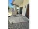 Inviting front porch with stylish stone, secure wrought iron door, and solar lighting at 1718 S Longmore St # 53, Mesa, AZ 85202