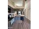 Kitchen features white countertops and gray cabinets, with a view into another room at 1718 S Longmore St # 53, Mesa, AZ 85202