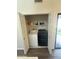 Laundry closet with stacked washer and dryer at 1718 S Longmore St # 53, Mesa, AZ 85202