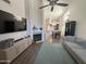 Bright living room featuring a modern fireplace, high ceilings, and seamless flow into the dining area at 1718 S Longmore St # 53, Mesa, AZ 85202