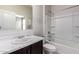 Traditional bathroom featuring a shower over bath and sink with a marble countertop at 1748 W Cameron Blvd, Coolidge, AZ 85128