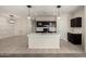 A modern kitchen with an island, stainless steel appliances, dark cabinets, and stylish pendant lighting at 1748 W Cameron Blvd, Coolidge, AZ 85128