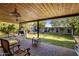 Spacious covered patio overlooking a lush backyard, perfect for outdoor entertaining and relaxation at 1825 E Palo Verde Dr, Phoenix, AZ 85016