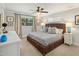 Bedroom featuring a woven bed frame, neutral decor, and natural light at 1825 E Palo Verde Dr, Phoenix, AZ 85016