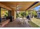 Inviting covered patio with ceiling fan, ideal for outdoor dining and enjoying the serene backyard views at 1825 E Palo Verde Dr, Phoenix, AZ 85016