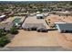 Aerial view of the property showcasing the house, garage, and spacious surrounding land at 19711 W Colter St, Litchfield Park, AZ 85340