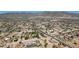 Picturesque aerial view of a residential area nestled against a mountain backdrop, emphasizing neighborhood charm at 19711 W Colter St, Litchfield Park, AZ 85340