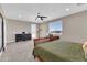Bedroom with lots of room, neutral colors, carpet, and access to the patio at 19711 W Colter St, Litchfield Park, AZ 85340