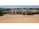 Sprawling desert home featuring a two-car garage, charming front porch and low-maintenance landscaping at 19711 W Colter St, Litchfield Park, AZ 85340