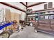 Garage featuring lots of equipment, a sofa, shelving, and storage solutions at 19711 W Colter St, Litchfield Park, AZ 85340