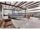 Spacious garage featuring a boat, sofa, and ample space for projects and storage at 19711 W Colter St, Litchfield Park, AZ 85340