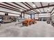 Spacious garage features a tractor, boat, and lots of open floor space for work and storage at 19711 W Colter St, Litchfield Park, AZ 85340